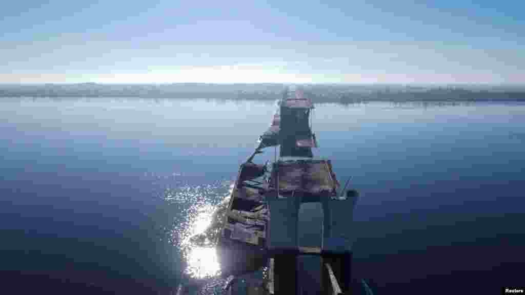 A view of the destroyed Antonivskiy Bridge over the Dnieper River, which was rendered impassable over the summer due to repeated rocket and missile strikes. Russia's withdrawal from Kherson marks another victory for Kyiv as the front lines on the battlefield continue to be redrawn.&nbsp;