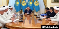 Kazakh President Nursultan Nazarbaev (center) made his remarks on Islamic garb while meeting with the country's religious leaders in the capital, Astana, on April 19.