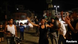 Palestinezët duke festuar pasi u arrit marrëveshja e armëpushimit me Izraelin. Gaza, 13 maj 2023.