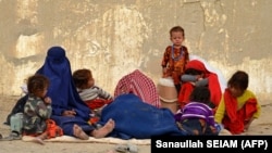 Afghan refugees rest upon their arrival from Pakistan at a registration center near the Afghan-Pakistani border in the Spin Boldak district of Kandahar Province on November 6. 
