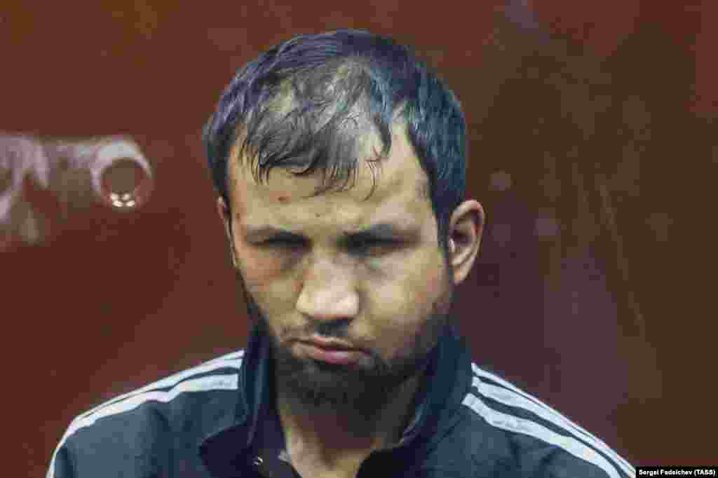 Shamsiddin is seen here pictured in court in Moscow on March 24 with a swollen and bruised face. Earlier, the Tajik man was filmed as he was apparently being tortured by security forces with an electrical cable attached to his genitals. Aiden Aslin, a British national who was captured by Russia while fighting for Ukraine during the battle of Mariupol, told RFE/RL that he believes the publication of apparent torture of the terror suspects is intended to "set an example." The former Ukrainian marine says such abuse of suspects yet to be found guilty of any crime is at "the same level" as the extrajudicial violence he says he witnessed while in Russian captivity.&nbsp;