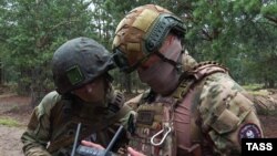 "Вагнер" менчик аскердик компаниясынын жалданма аскерлери.