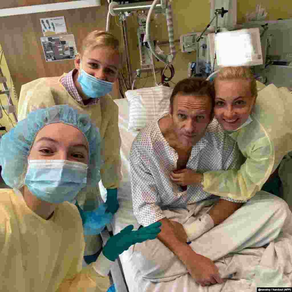 Navalny poses for a picture with his family at Berlin's Charite hospital on September 15, 2020. German doctors who treated Navalny announced that he had been poisoned with a nerve agent from the Novichok group, a deadly chemical weapon. Navalny spent weeks in a medically induced coma. &nbsp;