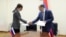 Armenia - Armenia's Deputy Minsiter of High-Technology Avet Poghosian and Russia's Deputy Minister of Mass Communication Bella Cherkesova sign a joint statement in Yerevan.