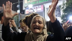 Рамалла шаарында көчөгө чыккан палестин аял. 31-октябрь, 2023-жыл. 
