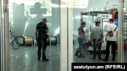 Police with a bomb-sniffer dog at one of the metro stations in Yerevan (file photo).