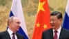 Președintele Rusiei, Vladimir Putin (stânga) și omologul său chinez, Xi Jinping (dreapta), în timpul unei vizite a liderului de la Kremlin în China. 4 februarie 2022. 