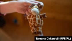 The giraffe keychain that has become an important reminder of home for the Pavlenko family ever since they fled the war in Ukraine. 