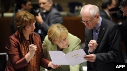EU High Representative for Foreign Affairs and Security Policy Catherine Ashton, German Chancellor Angela Merkel, and European Council President Herman Van Rompuy (left to right) talk prior to the roundtable meeting in Brussels on June 28.
