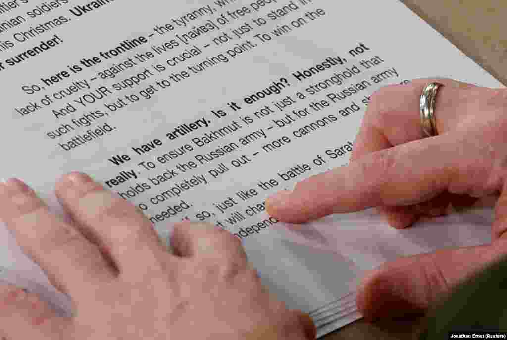 Zelenskiy reads from his notes during his address to the U.S. Congress.