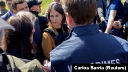 German Foreign Minister Annalena Baerbock visits a church where a mass grave was found after Russian forces retreated from Bucha on May 10.