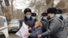 Одно из предыдущих задержаний участницы пикета перед зданием консульства Китая. Алматы, 8 декабря 2021 года
