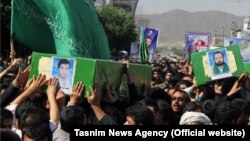 A funeral is held in the Iranian city of Mashhad for four Afghan refugees who were killed in action in Syria. (file photo)