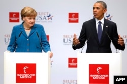 U.S. President Barack Obama (right) and German Chancellor Angela Merkel speak to the press as they tour the Hannover Industrial Fair on April 25.