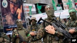 Militantët e Hamasit gjatë një parade. Qyteti i Gazës, 22 maj 2021. 