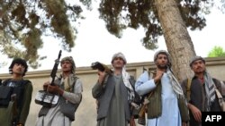 Local militia fighters in Kunduz in May .