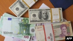 Dollarë, euro dhe valuta iraniane, rial