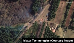 A satellite picture of the border between Poland and Belarus taken on November 10 shows a large group of migrants who have grouped along parts of the border, seeking to cross into Poland.