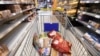 Imagine generică în care este arătat un cărucior cu cumpărături într-un supermarket.