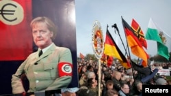 Supporters of Pegida take their anger out on Germany's chancellor, Angela Merkel.