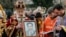 Orthodox priests stand next to a coffin containing the body of investigative journalist Heorhiy Gongadze, who was killed in 2000, during a funeral ceremony in Kyiv on March 22. 