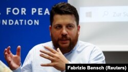 The warrant for Leonid Volkov (pictured) is seen as part of an effort to squelch demonstrations demanding the release of Aleksei Navalny, President Vladimir Putin's most vocal critic.