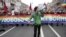 LGBT activists carry a banner reading "Love is stronger than war" during a May Day demonstration in St. Petersburg in 2014.