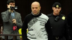 Dmitry Pavlyuchenkov (center) is escorted into a Moscow courtroom on December 14.