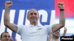 Robert Kocharian greets addresses supporters during the campaign rally in Yerevan on June 18.