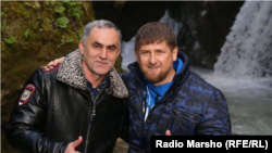 Chechen leader Ramzan Kadyrov (right) with district police chief Nazhud Guchigov. (file photo)