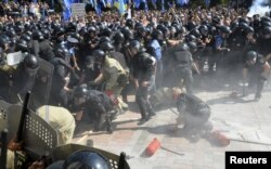 A hand grenade exploded amid the protests, killing at least three and injuring scores.