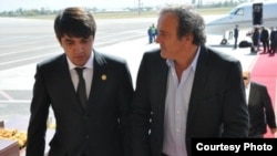 Рустам Эмомали УЕФА президенти Мишел Платини менен 10-октябрь, 2012-жыл