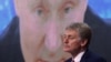 RUSSIA – Kremlin spokesman Dmitry Peskov sits in front of a screen displaying Russian President Vladimir Putin addressing his annual press conference via a video link. Moscow, December 17, 2020 