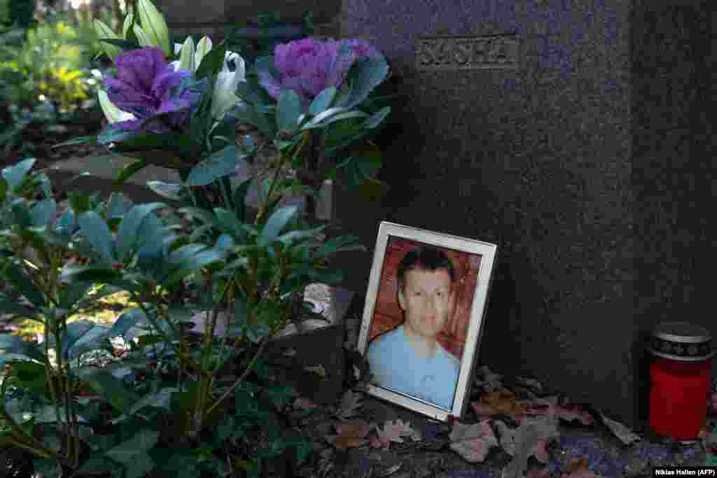 A photograph sits beside Aleksandr Litvinenko's gravestone in Highgate Cemetery in North London.