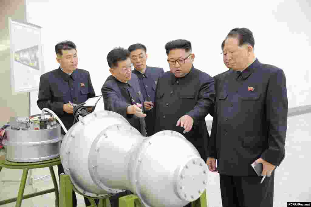 Kim inspecting what North Korean media claimed was a hydrogen bomb small enough to be slotted into an intercontinental ballistic missile (ICBM). The North Korean leader doubled down, responding to Trump's challenge by threatening U.S. territory (Guam) with &ldquo;an enveloping fire.&rdquo; 