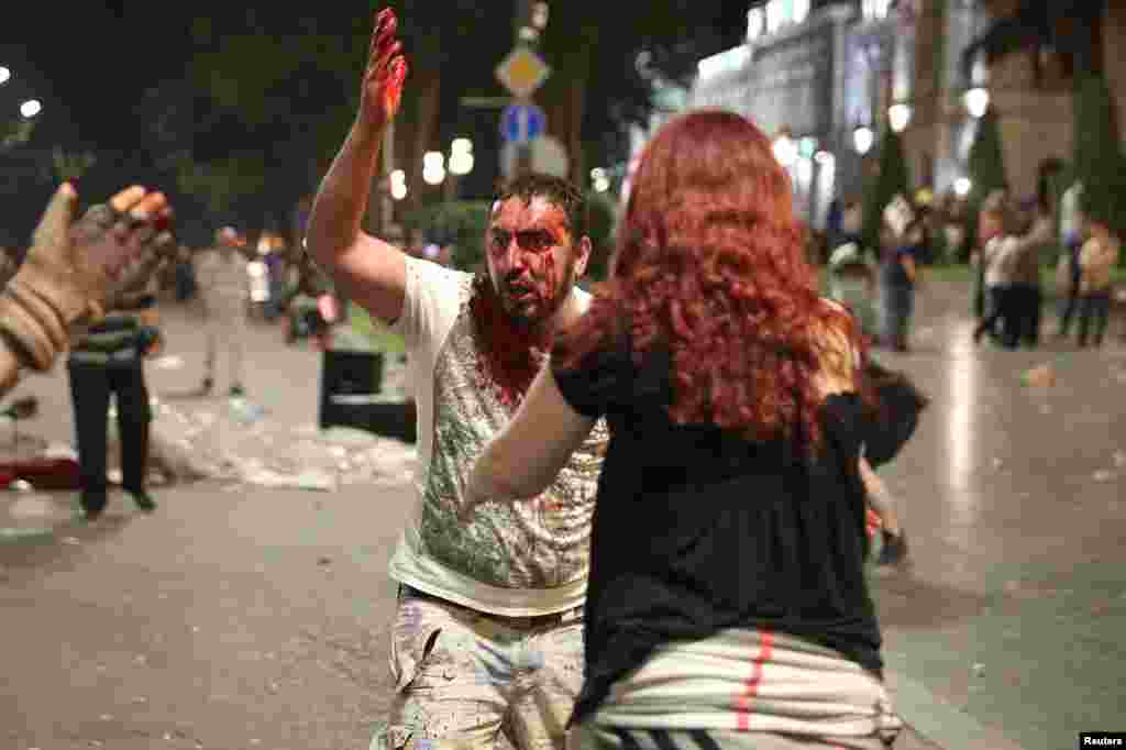 A man bleeding heavily in the early hours of June 21. Battles between police and security personnel continued through the night.&nbsp;
