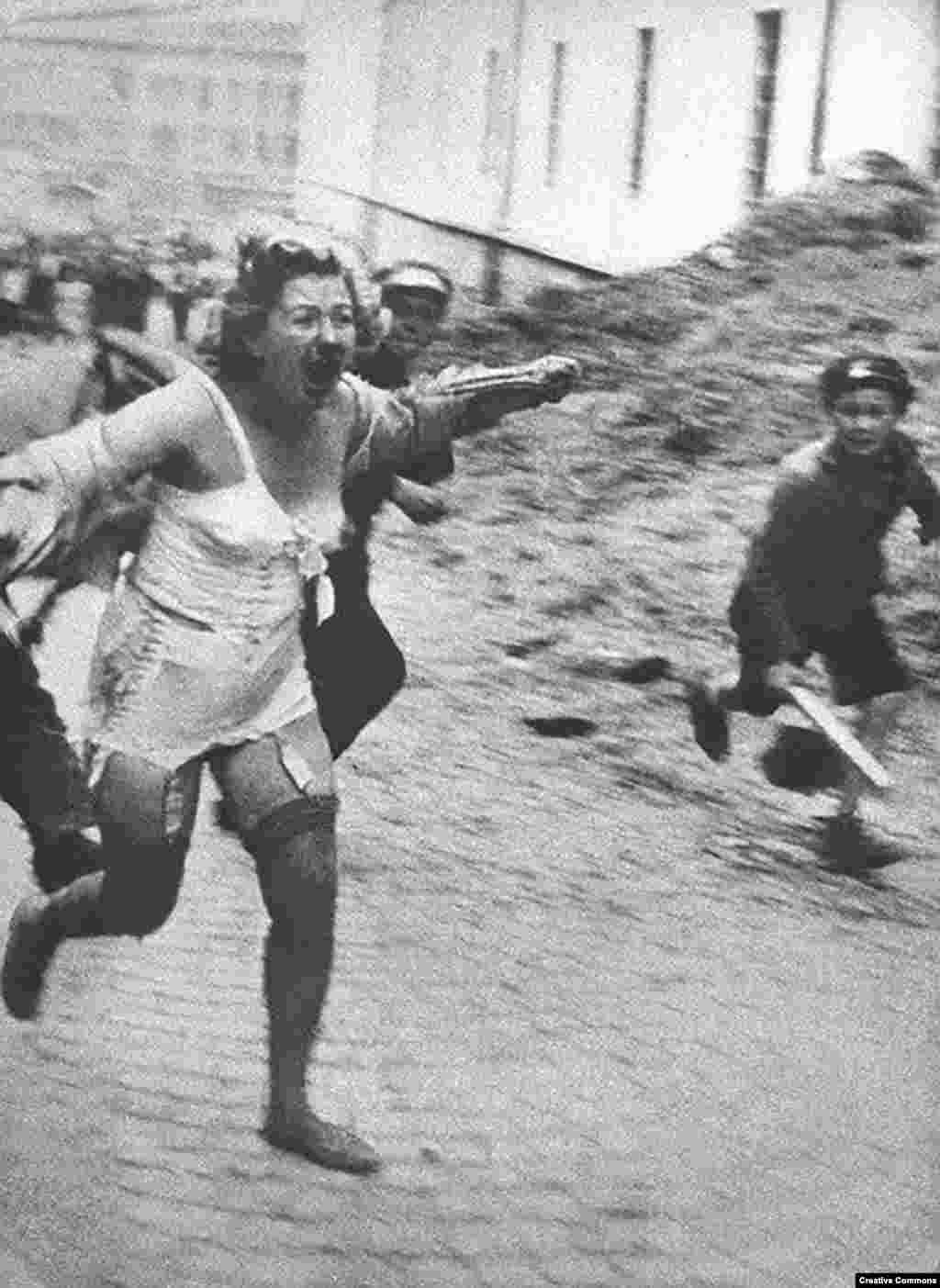 With the active encouragement of the Nazis, horror is unleashed on the Jewish population of the Soviet Ukraine and territories that had been occupied by Soviet forces. This woman is fleeing from a mob in Lviv, a Polish city overtaken by Soviet and then Nazi forces that is today part of western Ukraine -- in June or July 1941. Thousands of Jews were tormented and murdered by mobs of locals during a series of pogroms in Central and Eastern Europe.&nbsp; &nbsp;