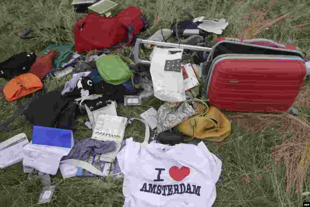 Passengers' personal belongings and luggage amid the debris of the Boeing 777 jet.&nbsp;