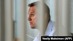 Russian opposition leader Aleksei Navalny attends a hearing at a court in Moscow on June 24.
