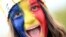 O tânără pictată pe față în culorile steagului României. România a pierdut meciul din optimi cu Olanda, scor 0-3.