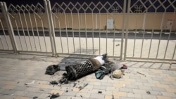 Remnants of an Iranian missile intercepted over Qatar are seen on a pavement on June 23, 2025.