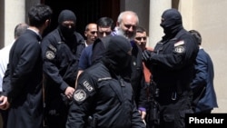 Armenia - National Security Service officers arrest Archbishop Bagrat Galstanian in Yerevan, June 25, 2025.