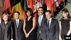 The German, U.S., and French leaders with their spouses in Baden-Baden on April 3