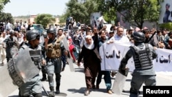 Afghan riot police clashed with demonstrators during an antigovernment protest in Kabul on June 2. At least five people were killed in the violence.