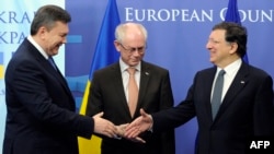 EU President Herman Van Rompuy (center) and European Commission President Jose Manuel Barroso (right) welcome Ukrainian President Viktor Yanukovych ahead of an EU-Ukraine Summit in Brussels earlier this year. 