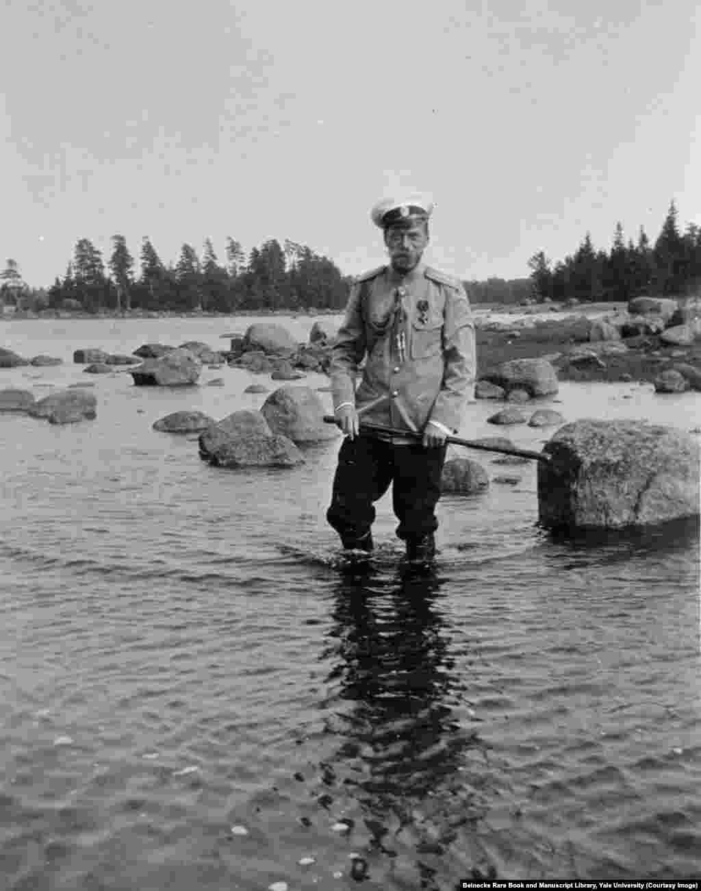Tsar Nicholas II wading on the rocky shore of Finland. After the early death of his father, he confided to a friend, "I am not yet ready to be tsar. I know nothing of the business of ruling."