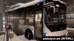 Armenia - An empty public bus is parked in the center of Yerevan amid heavy snowfall, February 20, 2025.