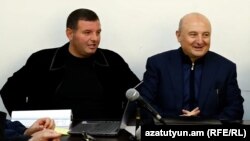 Armenia -Gyumri Mayor Vartan Ghukasian (right) and his son Spartak stand trial.