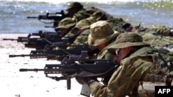 Lithuanian troops take part in a multinational NATO training exercise. Reports that the alliance could be bolstering its presence in Eastern Europe have drawn sharp criticism from Moscow. (file photo)