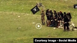 Grab from a video that shows militants loyal to the Islamic State (IS) blowing up bound and blindfolded Afghan prisoners with explosives. The victims were from Nangarhar province.